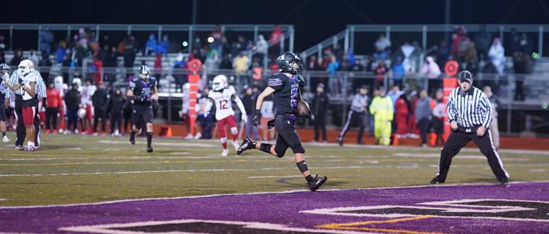 Downers Grove North's Owen Thulin (5) runs after the catch to score a touchdown against Kenwood during a class 7A playoff football game at Downers Grove North on Friday, Oct. 27, 2023.