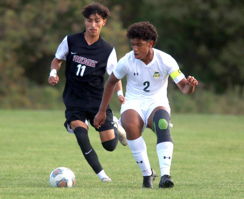 Crystal Lake South’s Diego Paguada battles Prairie Ridge’s Anthony Castro, left, in varsity soccer on Thursday, Sept. 19, 2024, at Prairie Ridge High School in Crystal Lake.