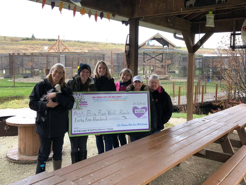 Theresa Konrath, Rainah Runty, and albino skunk Casper meet with 100+ Women members  Jane Passaglia, Maribeth Carlson, and Cherie McWherter to receive the organization's 'big check.'