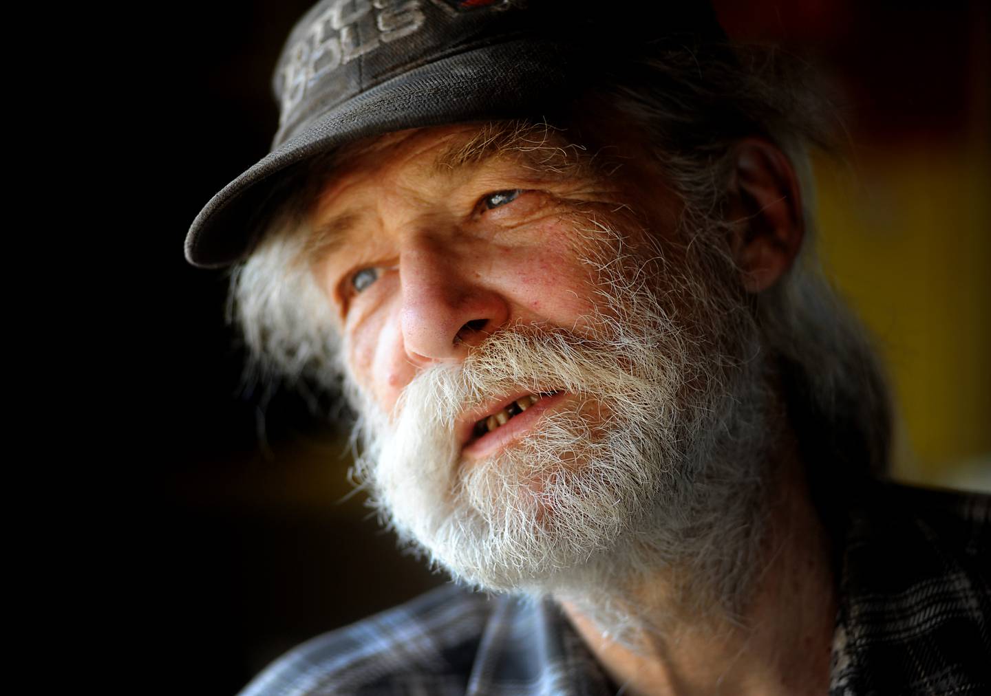 Gary Gauger, 70, pauses while checking on his pepper plants Monday, Feb. 28, 2022, on his farm near Richmond. He was wrongfully convicted in his parents' murder and then exonerated after members of the Outlaw motorcycle gang were named and convicted. One of those bikers was recently denied in his request for compassionate release from prison. Gauger still lives and farms near the property his parents owned and where they were killed.