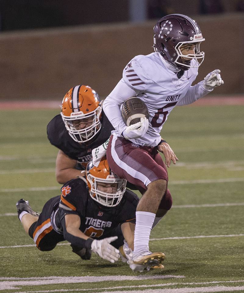 Tolono-Unity's Tre Hoggard picks up yards against Byron Friday, Nov. 28, 2025, in the Class 3A football finals at Hancock Stadium at ISU.