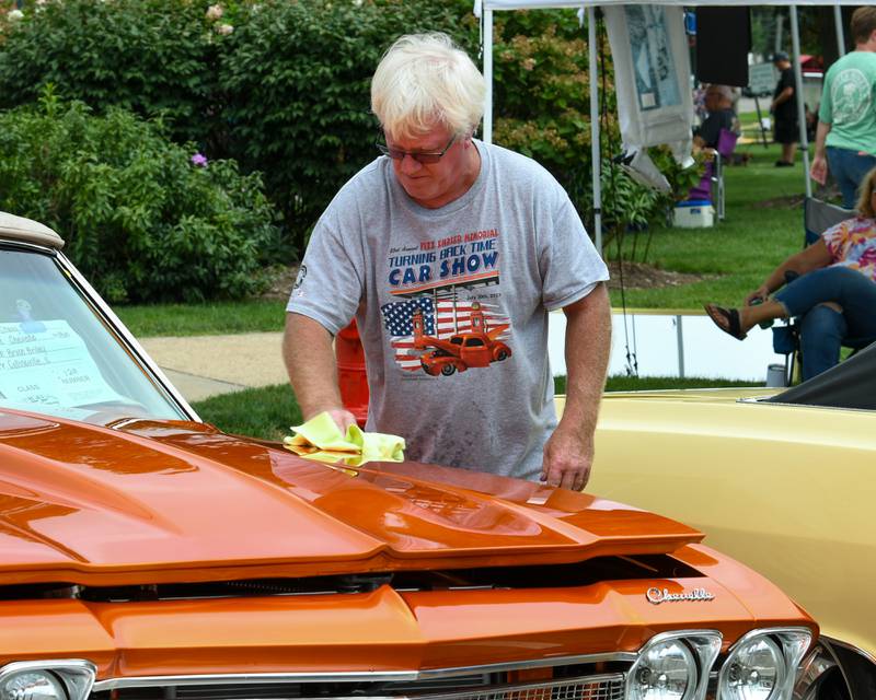Bruce Brieley of Collinsville whips down his 1968 Chevrolet Chevelle after light rain moved through Sycamore during the 24th annual Fizz Ehrler Memorial Turning Back Time Car Show held in downtown Sycamore on Sunday, July 28, 2024.