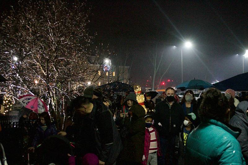 Families and community members crowded outside of Montgomery's Village Hall Dec. 5, to await the arrival of Santa and Mrs. Claus to light the Christmas tree and meet with families.