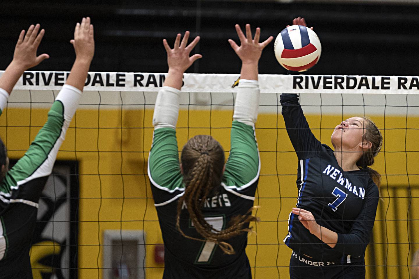 Newman’s Makenzie Duhon spikes against the Rock Falls defense Thursday, Oct. 26, 2023 in the class 2A regional finals at Riverdale.