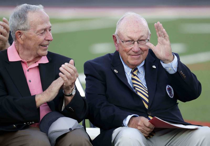 Marty, left and Neal Ormond III acknowledge the crowd during a ceremony to name the stadium for the Ormond family Thursday September 15, 2022 in Aurora.