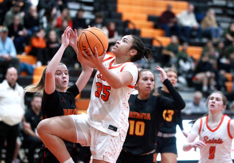 St. Charles East’s Corinne Reed gets the ball up during a game against Batavia on Wednesday, Jan. 8, 2025 in St. Charles.