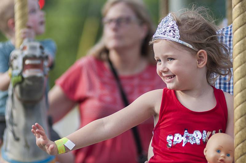 Carter Farias, 10, of Dixon rides the Scrambler Thursday, June 30, 2022 at Dixon’s Petunia Fest.