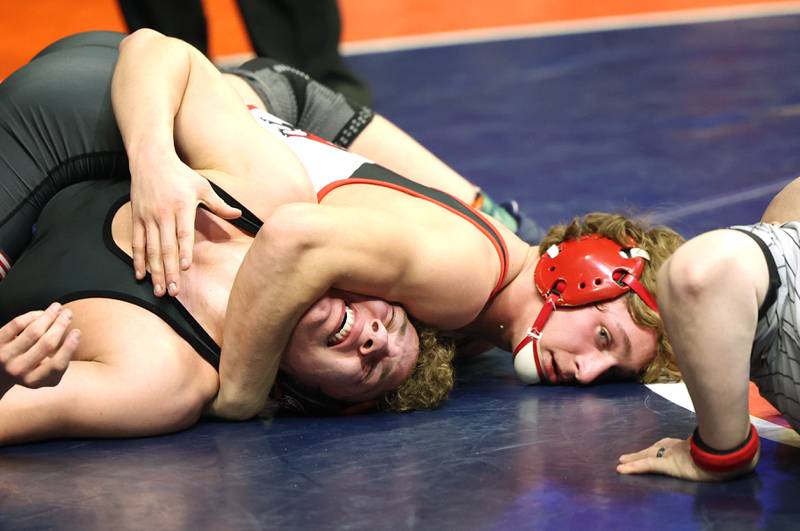 Yorkville’s Luke Zook works to pin Libertyville’s Matt Kubas in the Class 3A 170 pound 3rd place match Saturday, Feb. 18, 2023, in the IHSA individual state wrestling finals in the State Farm Center at the University of Illinois in Champaign.