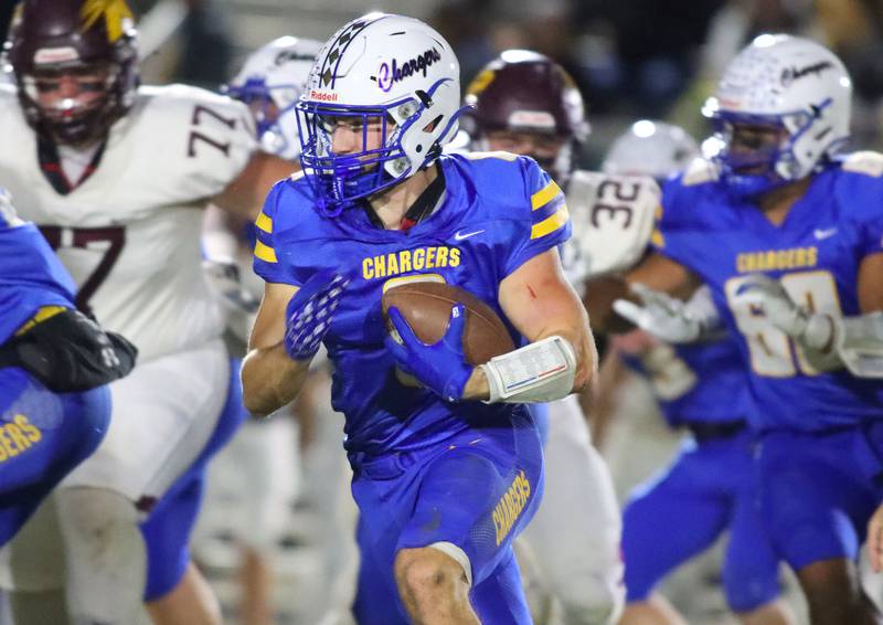 Aurora Central Catholic ballcarrier Trey Seifrid looks for room to run against Richmond-Burton in IHSA football Class 3A second-round playoff action at Bob Stewart Field on the campus of Aurora Central Catholic High School in Aurora on Friday, November 7, 2025.