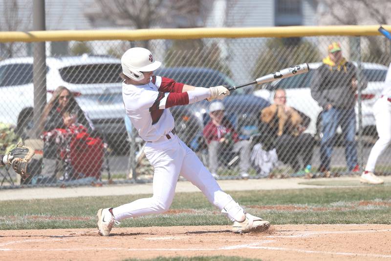 Plainfield North’s John St. Clair connects for a solo home run against Plainfield South on Friday, April 7, 2023.