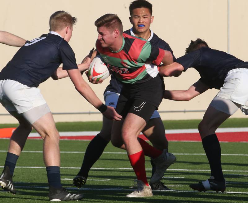 La Salle-Peru's Henry Dittman runs the ball against a string of La Salette Academy during a rugby game on Wednesday, April 12, 2023 at Howard Fellows Stadium at L-P High School.