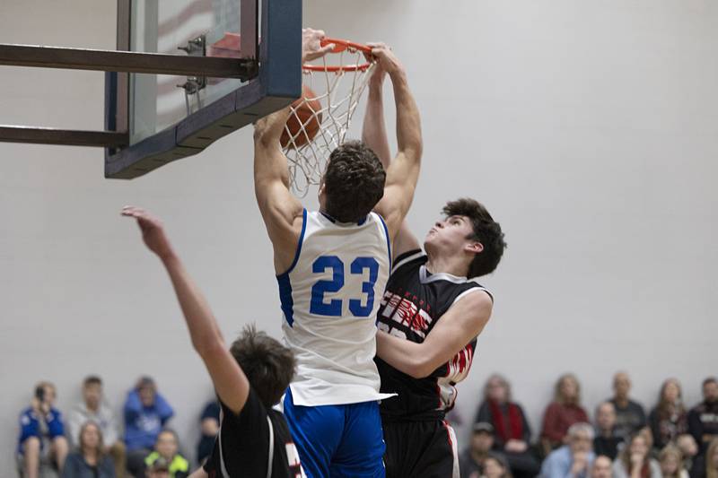 Faith Christian’s Levi Schuler stuffs the ball Thursday, Dec. 15, 2022 while playing Rockford Fire.