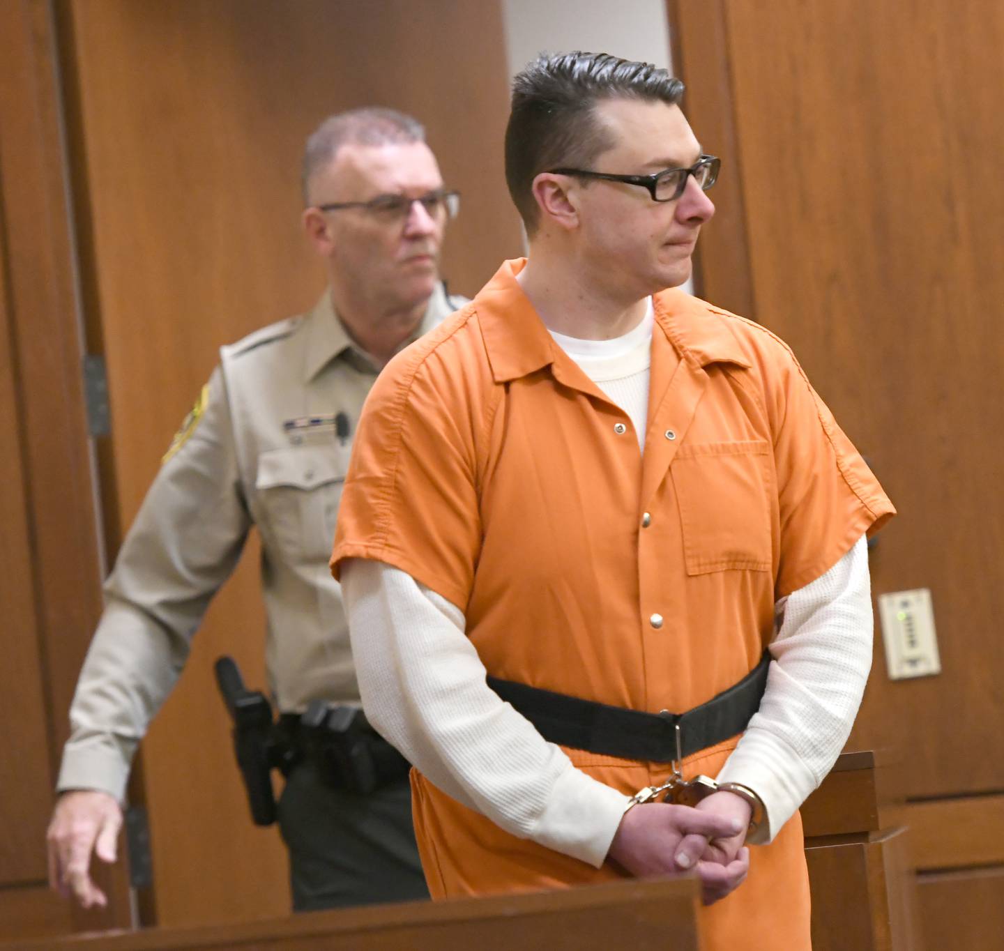 Duane Meyer is escorted into an Ogle County courtroom on Tuesday for a status hearing. He is charged with killing his ex-wife, Maggie Rosko, and their 3-year-old son, Amos.