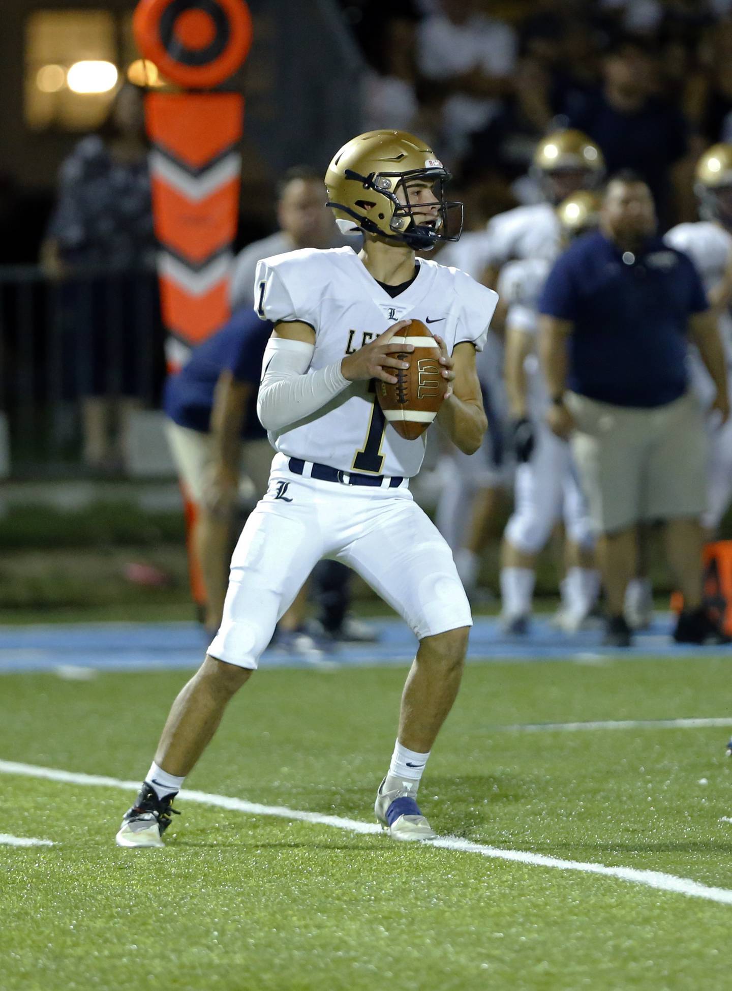 Lemont's Payton Salomon (1) drops back to pass during the boys varsity football game between Lemont High School and Nazareth Academy on Friday, Sept. 2, 2022 in LaGrange, IL.