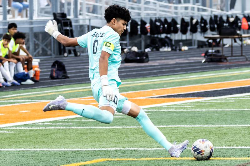 Romeoville's Saul Garcia kicks the ball down field during a varsity soccer away game against Minooka on Sept. 23, 2025.