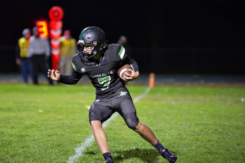 Oregon’s Gabe Eckerd runs for yards in the first half against Rock Falls Friday, Oct. 14, 2022.