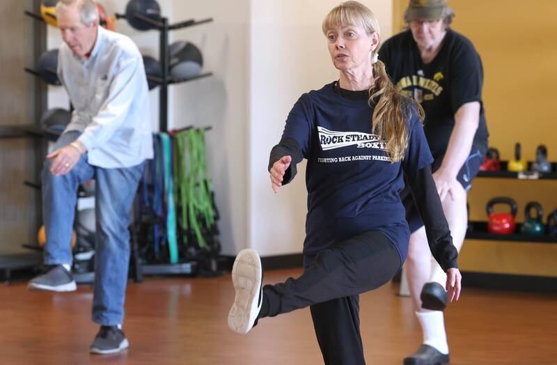 Instructor Sharon Smith leads her class in warmups Friday, April 28, 2023, during Rock Steady Boxing for Parkinson's Disease class at Northwestern Medicine Kishwaukee Health & Wellness Center in DeKalb. The class helps people with Parkinson’s Disease maintain their strength, agility and balance.