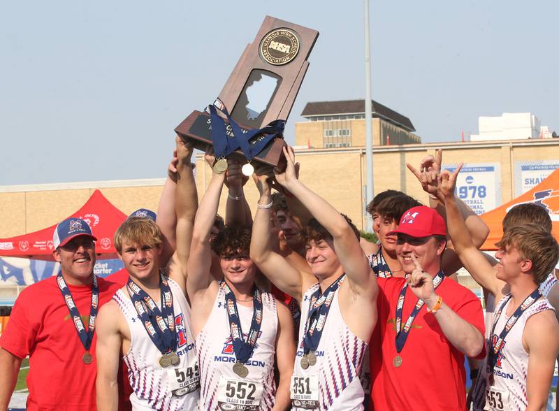 Members of the Morrison track team hoist the Class 1A first place trophy during the IHSA Class 1A Boys Track & Field State Finals on Saturday, May 31, 2025 at Eastern Illinois University in Charleston.