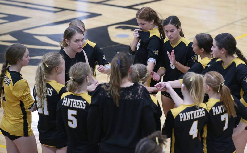 Members of the Putnam County volleyball team huddle with head coach Amy Bell while facing Marquette on Thursday, Sept 7, 2023 at Putnam County High School.