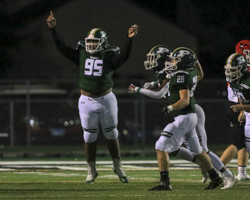 Plainfield Central's #95 celebrates a big defensive stop during football game between Plainfield Central vs Yorkville.  Sept 2, 2021.  Gary E Duncan Sr. for Shaw Local.