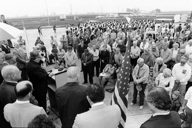 A crowd of people gather during the grand opening of the Illinois Valley Regional Airport as former Illinois Gov. Jim Thompson speaks on Friday, Oct. 18, 1985 in Peru