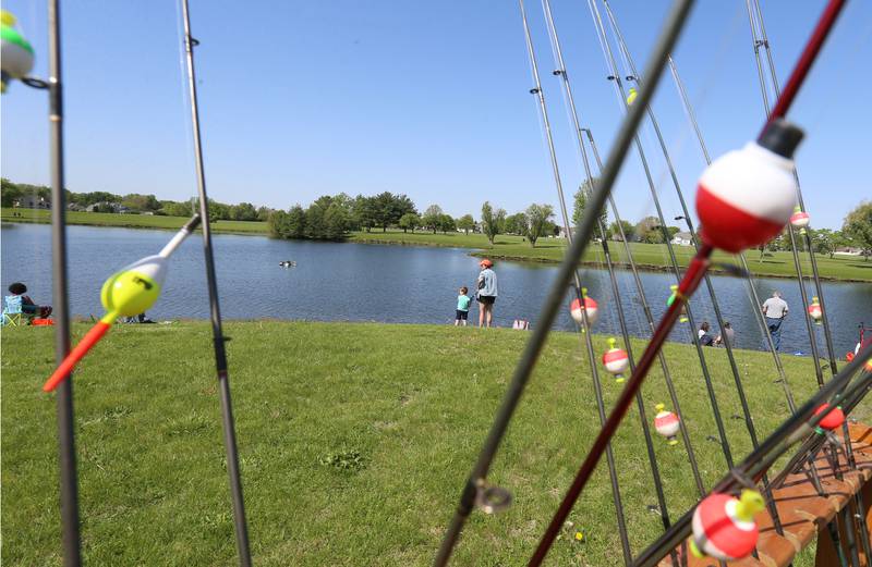 Families fish the shorline during the 25th annual Kids Fishing Expo on Saturday, May 10, 2025 at Baker Lake in Peru.
