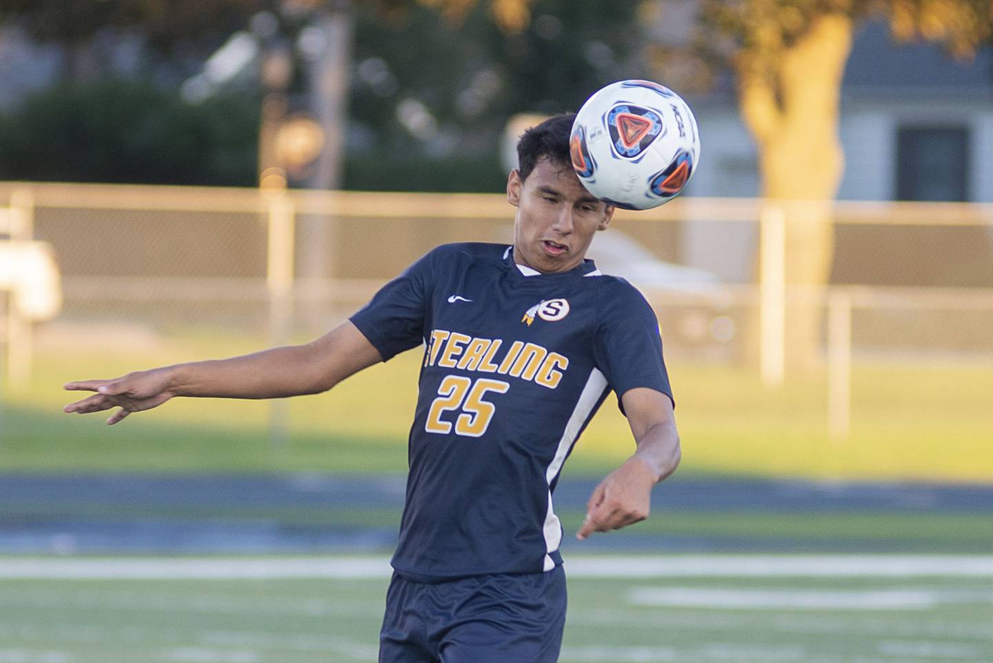 Sterling’s Felipe Sandoval heads the ball during the Warriors’ soccer match against United Township Tuesday, Aug. 30, 2022.