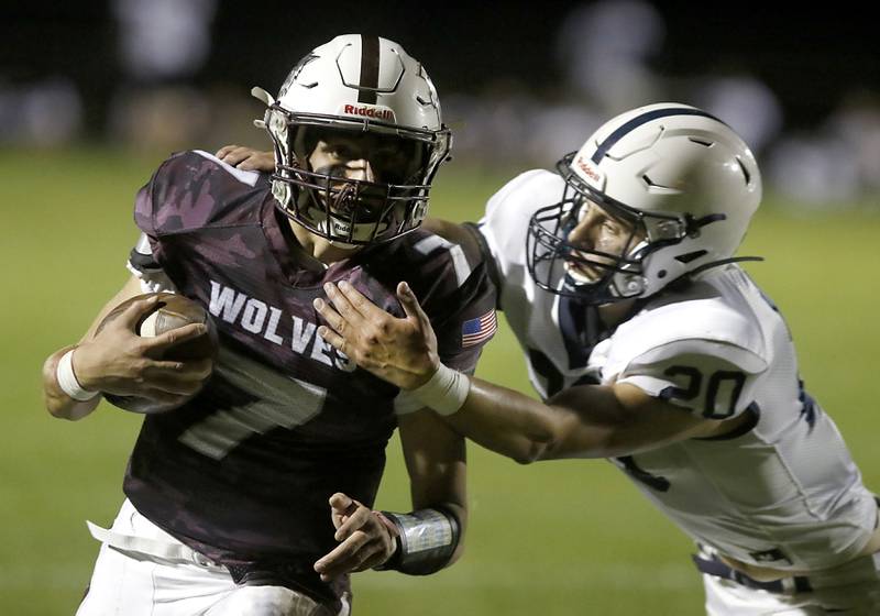 Prairie Ridge's Tyler Vasey is tackled by Cary-Grove's Conner Anderson during a Fox Valley Conference football game between Prairie Ridge  and Cary-Grove Friday, Sept. 23, 2022, at Prairie Ridge High School in Crystal Lake.