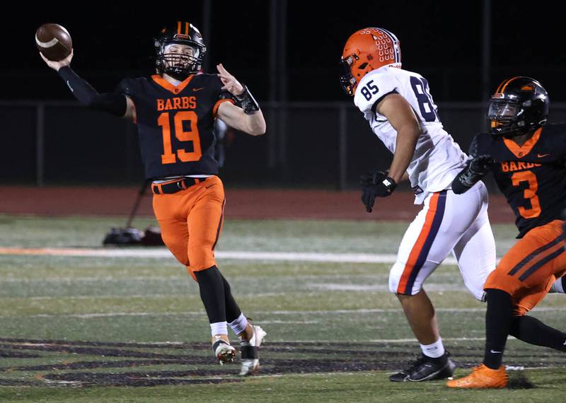 DeKalb's Michael Hodge gets a pass off just ahead of the rush of Stagg’s Saajan Ayers during their game Friday, Oct. 25, 2024, at DeKalb High School.