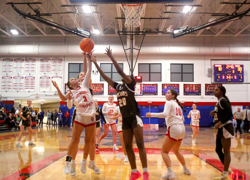 Jacobs’ Golden Eagles face off against Dundee-Crown’s Chargers in varsity girls basketball on Friday, Dec. 12, 2025, at Dundee-Crown High School in Carpentersville.
