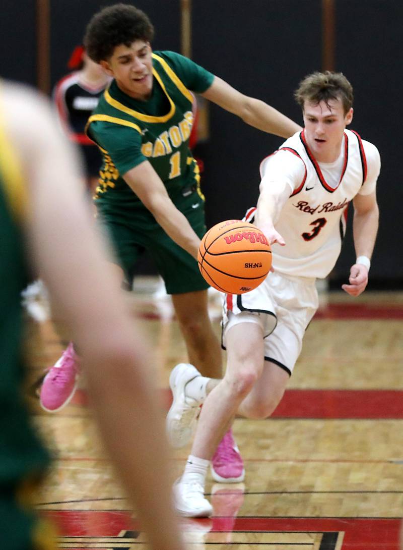 Crystal Lake South's Noah Cook steals the ball from Huntley's Aidan Gibbs during a Fox Valley Conference boys basketball game on Wednesday, Dec. 10, 2025, at Huntley High School.
