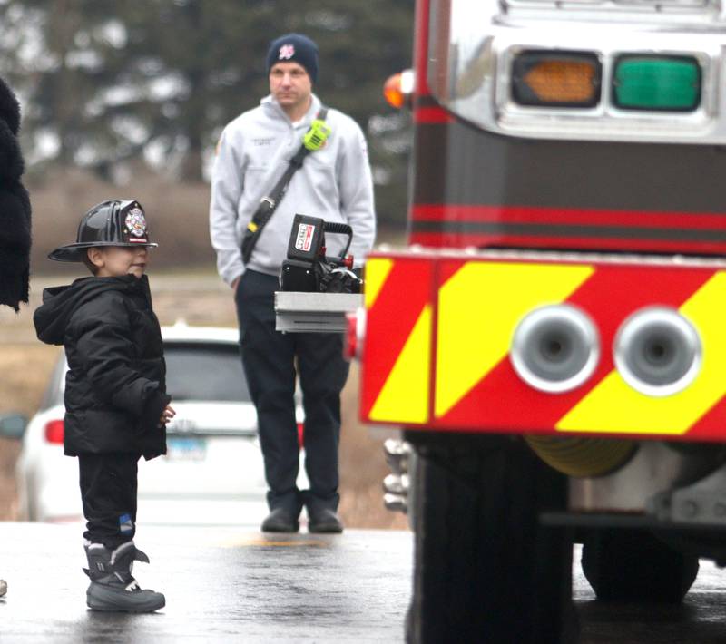 JJ Segura, 3, of DeKalb, admires a fire truck during a Read & Eat Fries With a Firefighter event Thursday, March 16, 2023, at the Culver’s in Huntley.