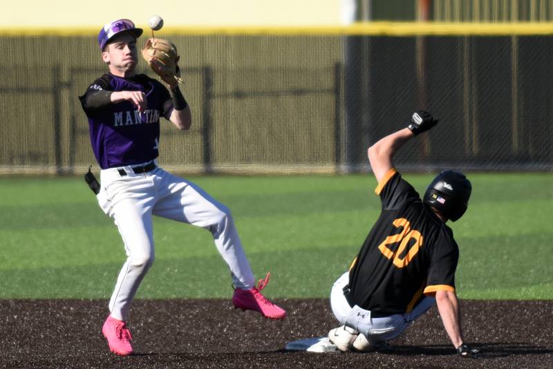 Manteno's Tyler Buehler, left, throws to first after forcing Herscher's Gaige Brown out at second during a game at Herscher Monday, May 11, 2026.