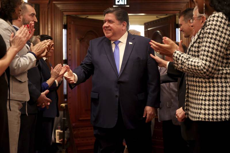 Illinois Gov. J.B. Pritzker arrives to deliver his State of the State and budget address before the General Assembly at the Illinois State Capitol, Wednesday, Feb. 21, 2024, in Springfield, Ill. (Brian Cassella/Chicago Tribune via AP, Pool)