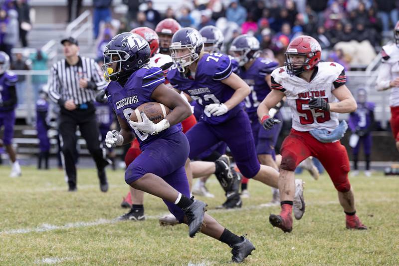 Rockford Lutheran’s Arlin Moore Jr. runs for yards Saturday, Nov. 5, 2022 during a round two football playoff game against Fulton.