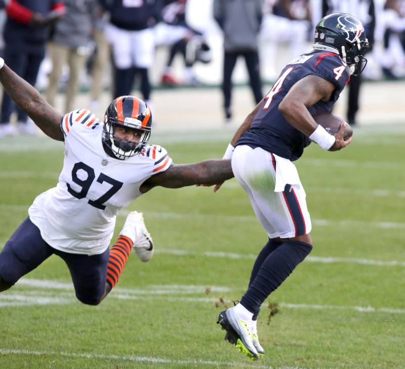 Chicago Bears defensive end Mario Edwards (97) helps sack Houston Texans quarterback Deshaun Watson (4) during their game Sunday at Soldier Field in Chicago.