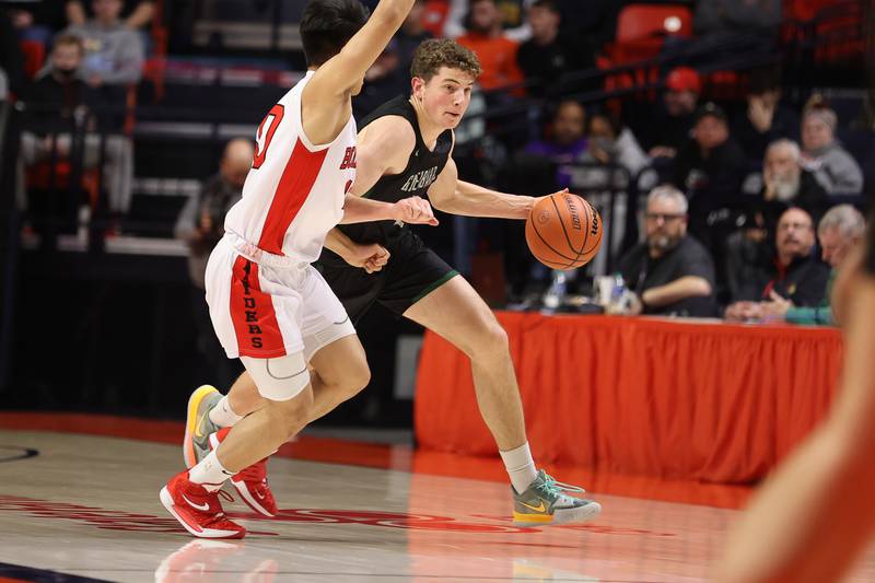 Glenbard West’s Caden Pierce makes a move against Bolingbrook in the Class 4A semifinal at State Farm Center in Champaign. Friday, Mar. 11, 2022, in Champaign.