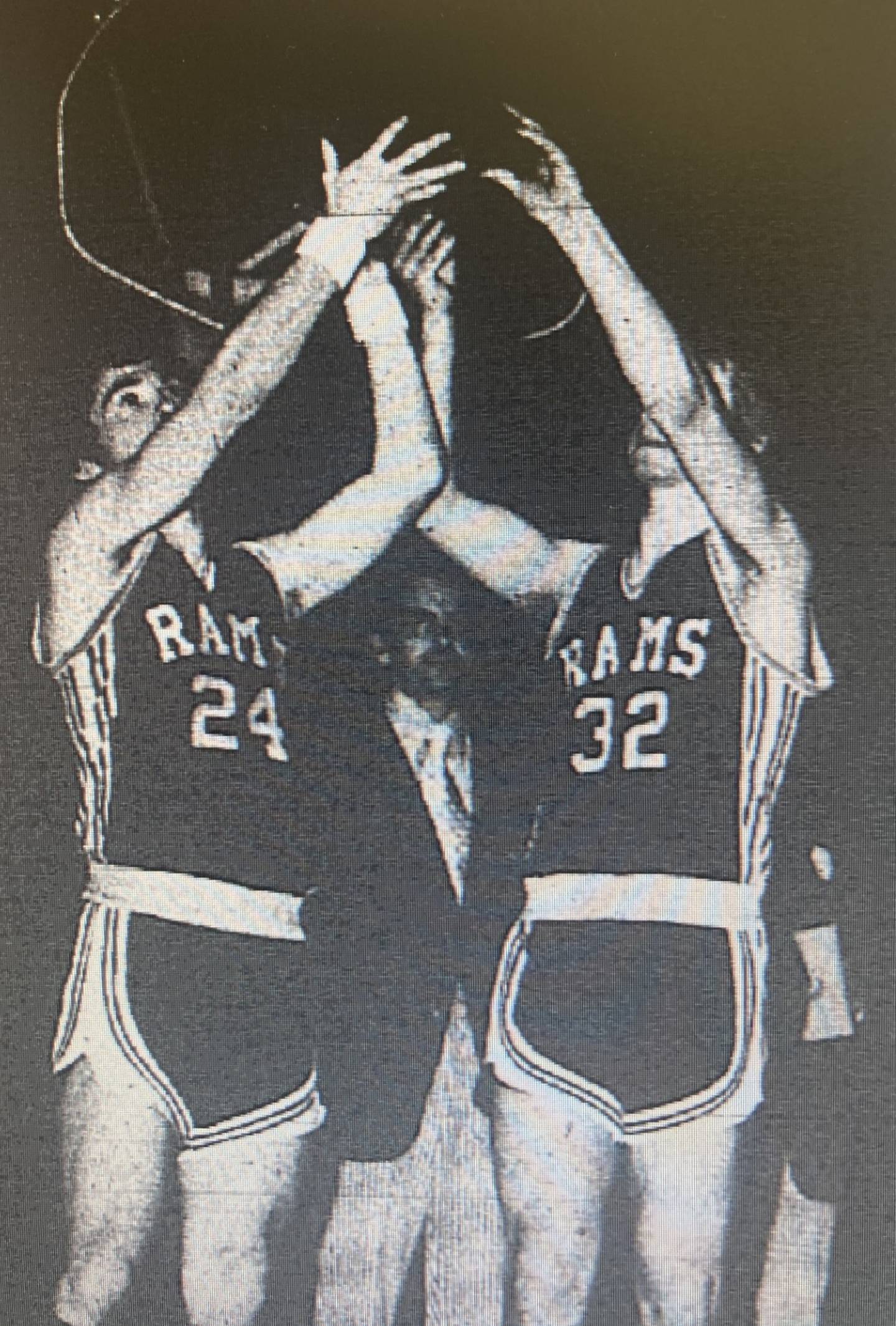 Western senior captains Kevin Anglin (24) and Dave Hartz (32) hoist the fourth-place trophy in the 1975 Class A state tournament.