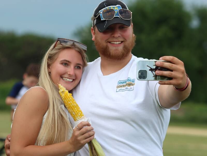 Riley Andresen of Hampshire, right, takes a selfie with Maddy Martin of Elgin Saturday, July 2, 2022, during the Red, White and Blue Food Truck FEASTival at Milky Way Park in Harvard.