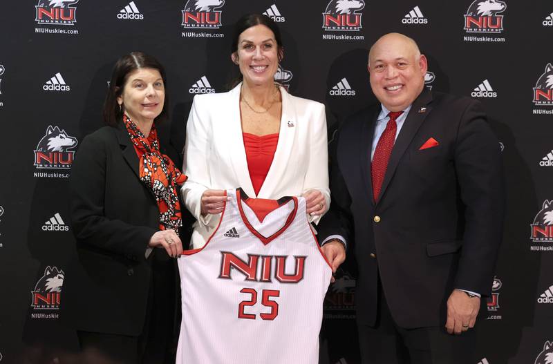 Lisa Freeman, (left) Northern Illinois University president, and Sean Frazier, vice president and director of athletics and recreation at NIU, with new NIU women’s basketball head coach Jacey Brooks Wednesday, April 9, 2025, in the Convocation Center at Northern Illinois University in DeKalb.