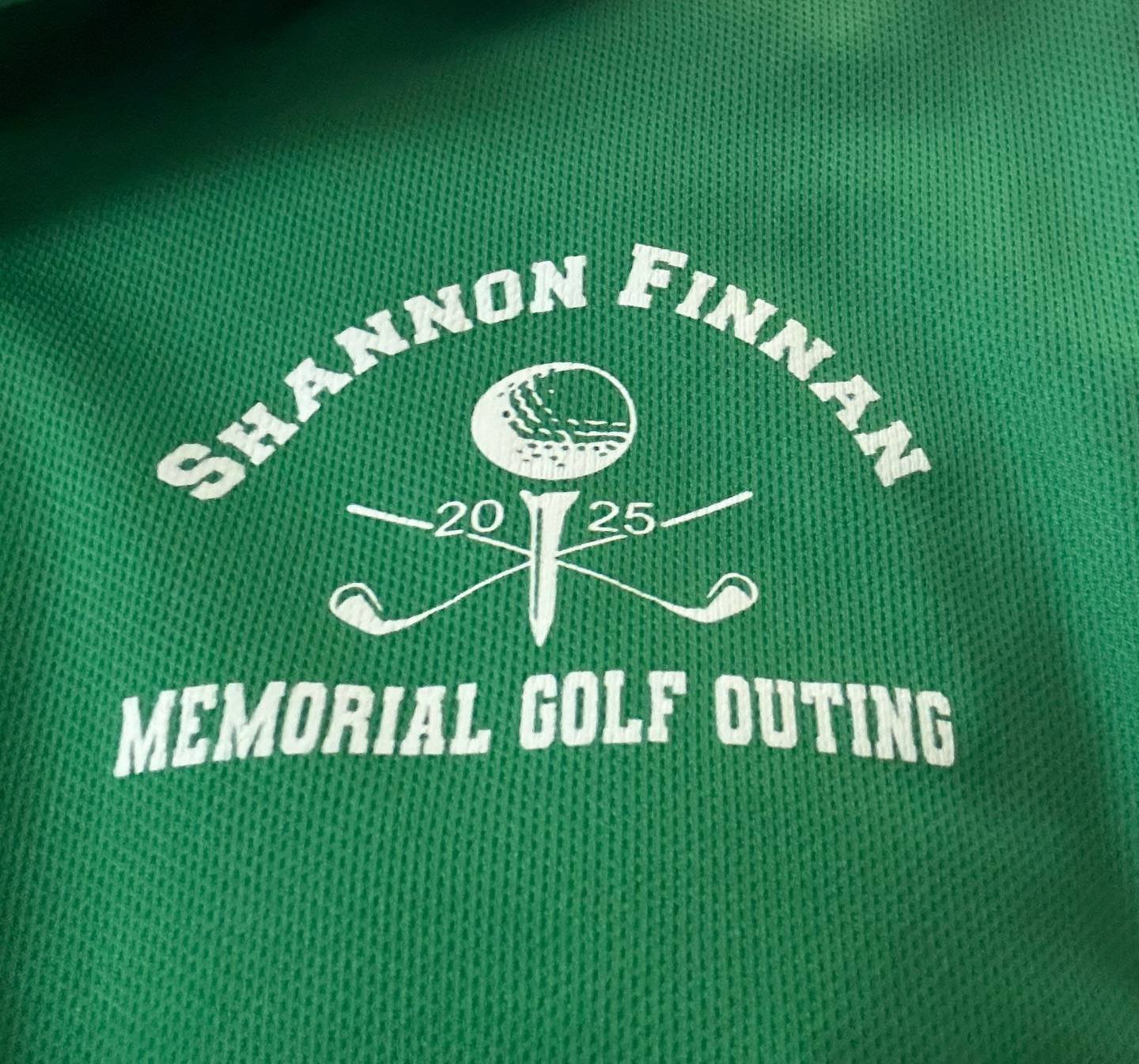 A T-shirt shows a logo for the Shannon Finnan Memorial Golf Outing, a charitable event held by Shannon's husband, Roger Finnan, in his wife's honor. Shannon was treated at Northwestern Medicine Cancer Center, the beneficiary of funds raised each year.
