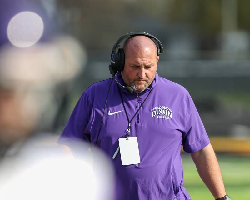 Dixon's head coach Dave Smith heads to the locker room with the team during Class 4A second round playoff football playoff game between Dixon at St Laurence.  Nov 4, 2023.