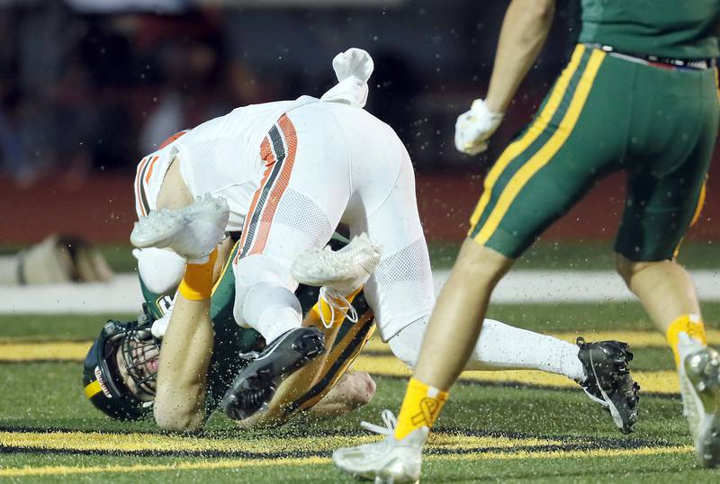 Fremd's Jack Wienke (2) rolls into the end zone for a touchdown against Hersey on a long pass Friday September 1, 2023 in Palatine.