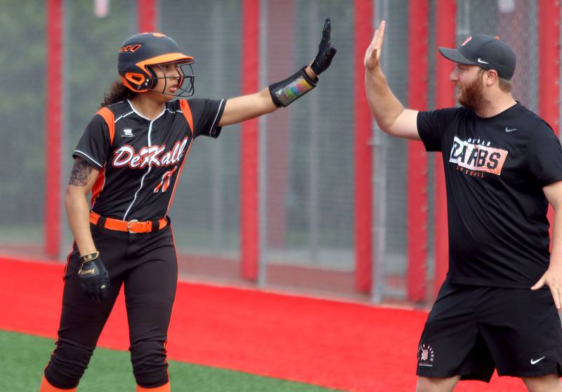 DeKalb’s Sydney Myles is greeted after connecting for a single against Huntley in IHSA Class 4A Sectional Semifinal softball action at Barrington High School in Barrington on Wednesday, June 4, 2025.