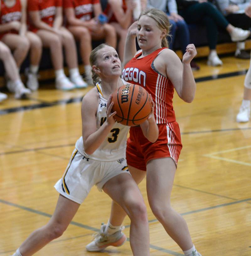 Polo's Carlee Grobe (3) looks to the basket as Oregon's Shaylee Davis (40) defends during a Tuesday, Dec. 5, 2023 game at Polo High School.