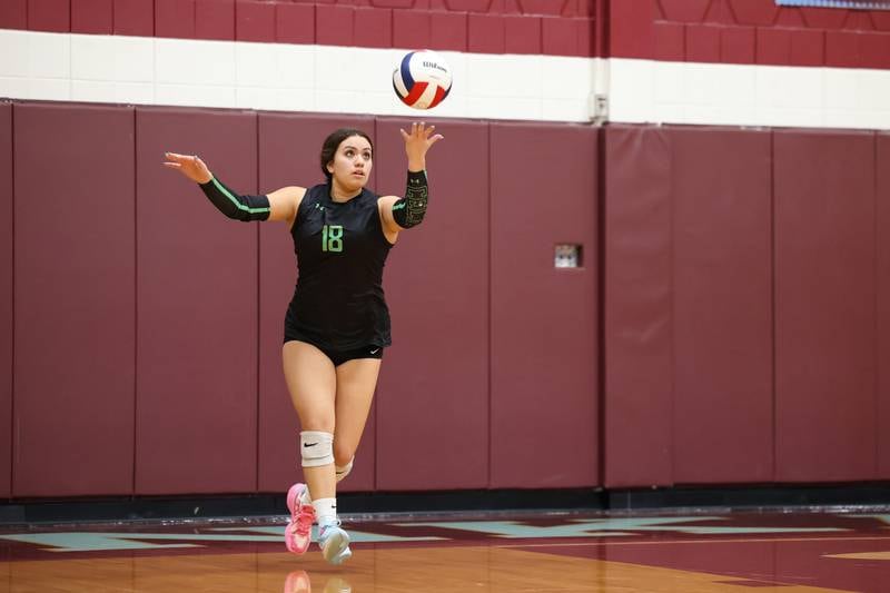 Providence's Juju Batshon tosses up the final serve of the match during Providence's victory in two sets, 25-25, 25-18, over Lemont in the IHSA Class 3A Kankakee Sectional championship on Thursday, Nov. 6, 2025.