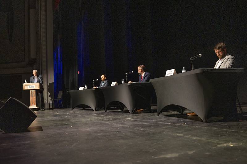 Sauk Valley Community College President David Hellmich (left) moderates a candidate forum for the 37th Senate District seat Thursday, Feb. 22, 2024, at The Dixon: Historic Theatre.