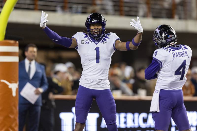 TCU wide receiver Quentin Johnston celebrates a touchdown against Texas with wide receiver Taye Barber the 2022 season.