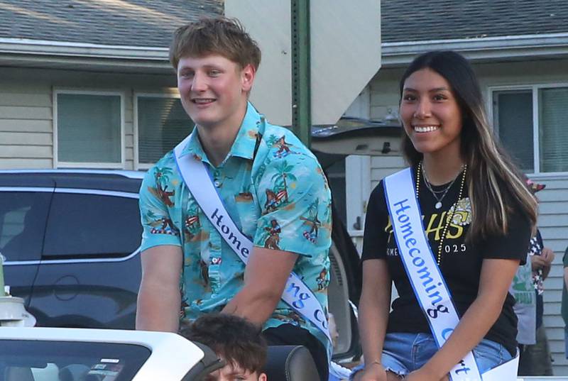 Putnam County HIgh School senior court students Carter Grandadam and Ashley Cano ride during the inaugural Homecoming parade on Wednesday, Sept. 17, 2025 down Elm Street in Granville.