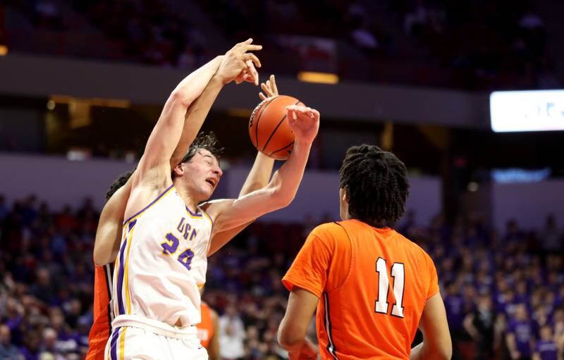 Downers Grove North’s Aidan Akkawi goes after a rebound during the Class 4A Normal Supersectional game against Normal Community on Monday, March 4, 2024.